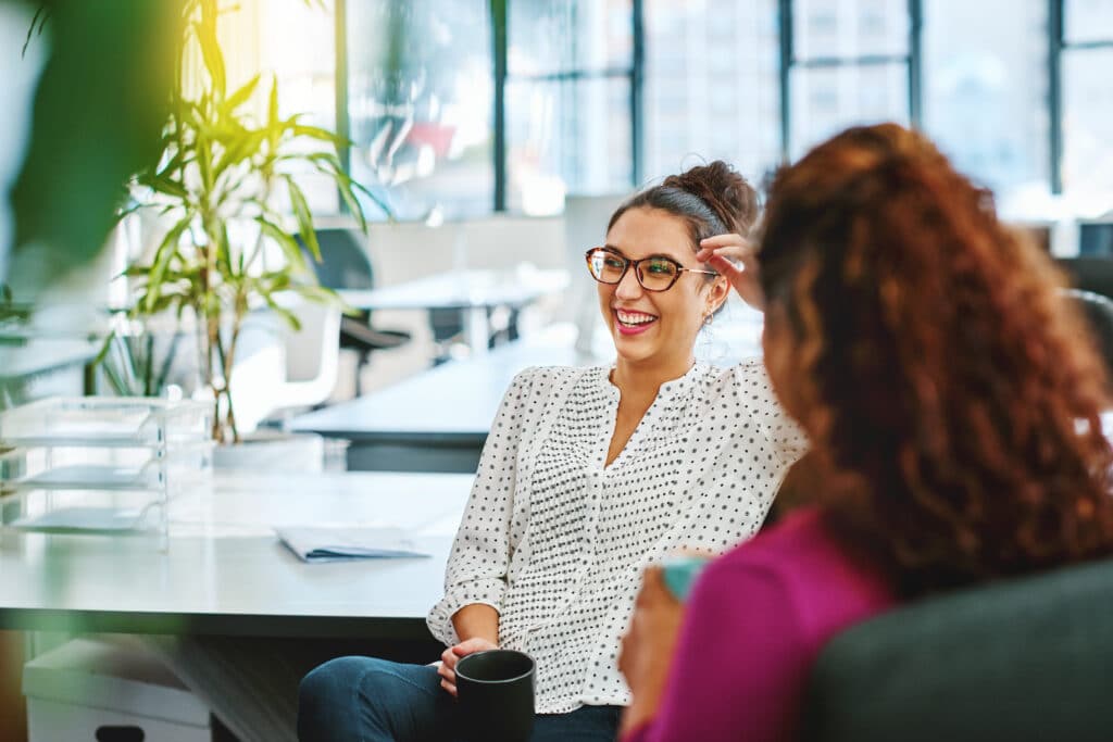 Shot of two businesswoman taking a break in an office